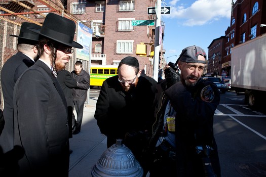 In Williamsburg Maisel listens to his police radio to find out what the police are doing now about a couple of men apprehended.